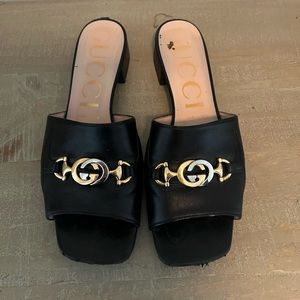 Women’s leather Gucci slides